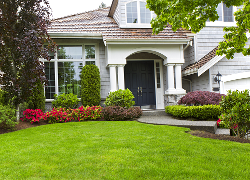 Beautiful front yard and home showing front door