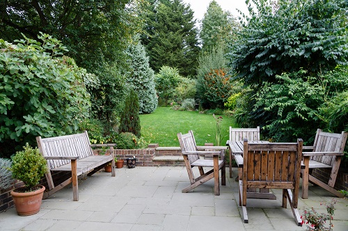 Patio surrounded by a lush garden