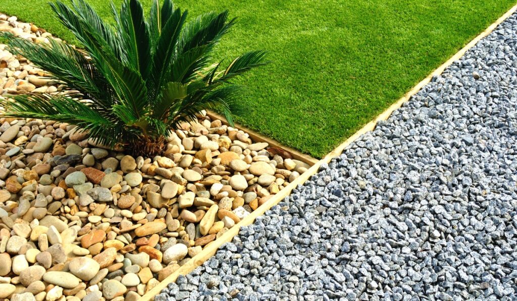 Professional Landscaped Yard With Grass, Rocks and Plants